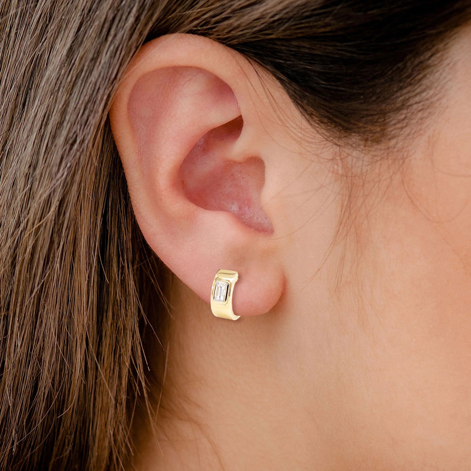 Diamond Solitaire Baguette Framed Huggie Earrings - in yellow gold (view 2 of 6)